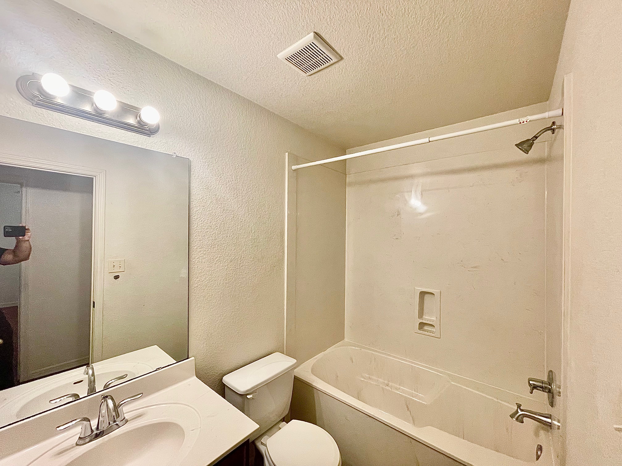 5018 205 Loop, Unit B Temple, TX 76502 - Photo 14 of 18 a bathroom with a sink mirror vanity and toilet
