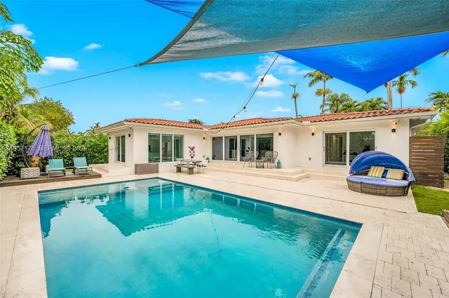 a kitchen with stainless steel appliances granite countertop a sink and a stove