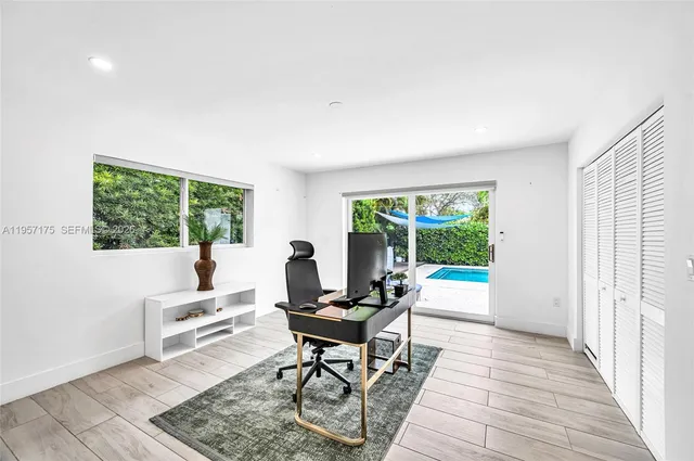 a workspace with furniture and a window