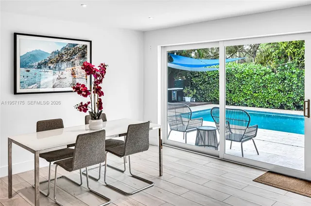 a swimming pool with outdoor seating and yard