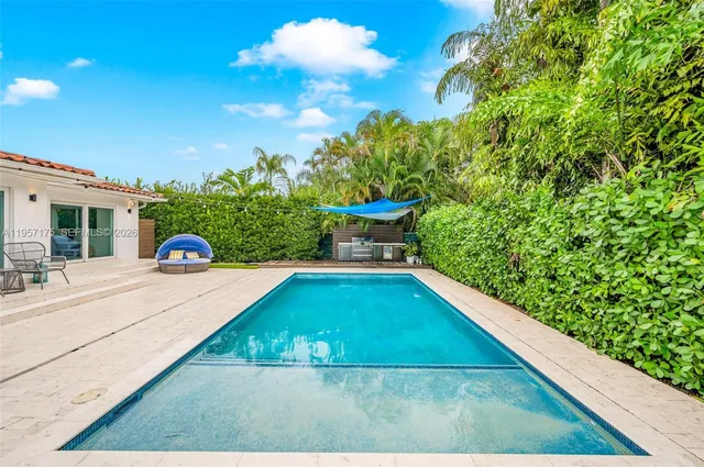 a backyard of a house with outdoor seating