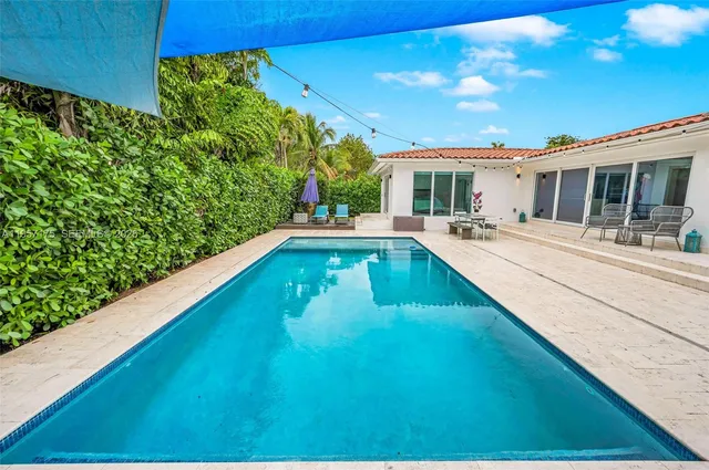 a view of a porch with a small yard