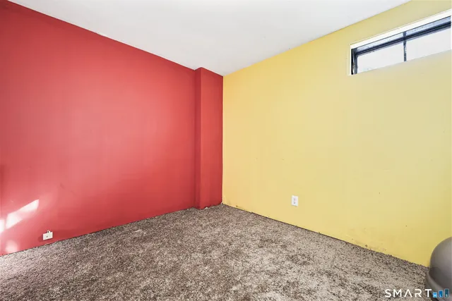 a view of a big room with wooden floor and small space