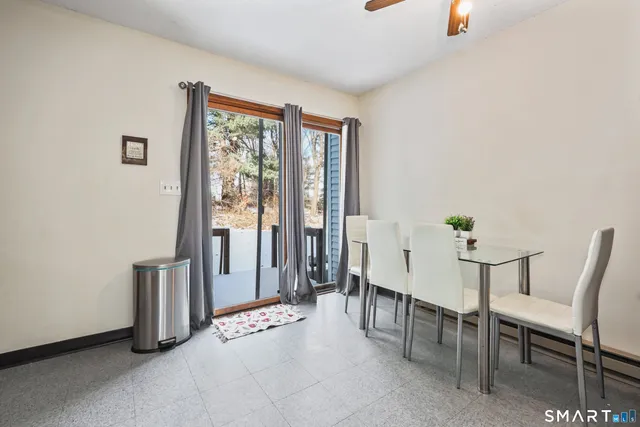 a view of a livingroom with furniture and windows