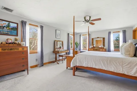a bed room with a bed and a dresser