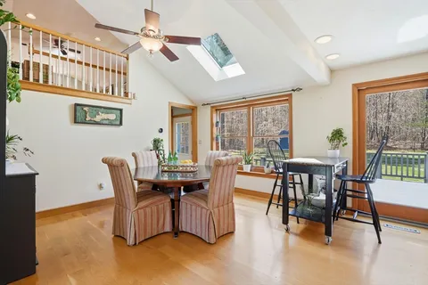 a view of a dining room with furniture window and outside view