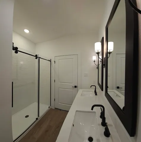 a bathroom with a tub and a sink