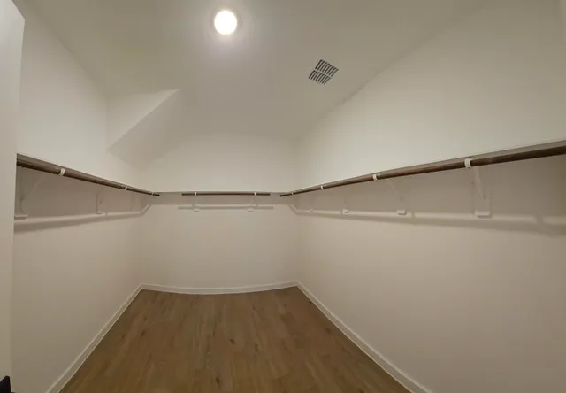 a view of an empty walk in closet