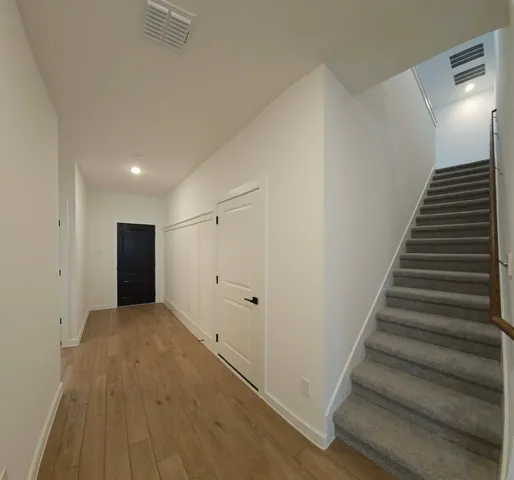 a view of a hallway with staircase
