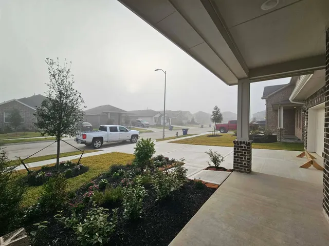 a view of a swimming pool with a garden