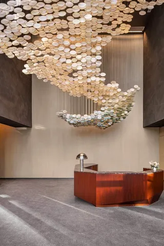 a room with a table and a chandelier