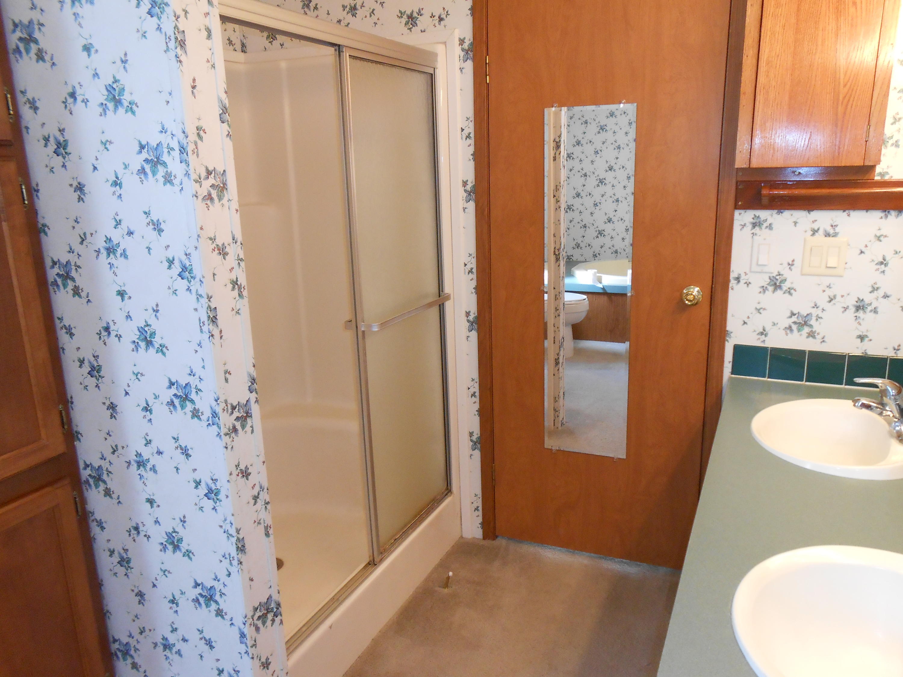 93 West Raphael Road DeFuniak Springs, FL 32433 - Photo 11 of 27 a bathroom with a sink and a mirror