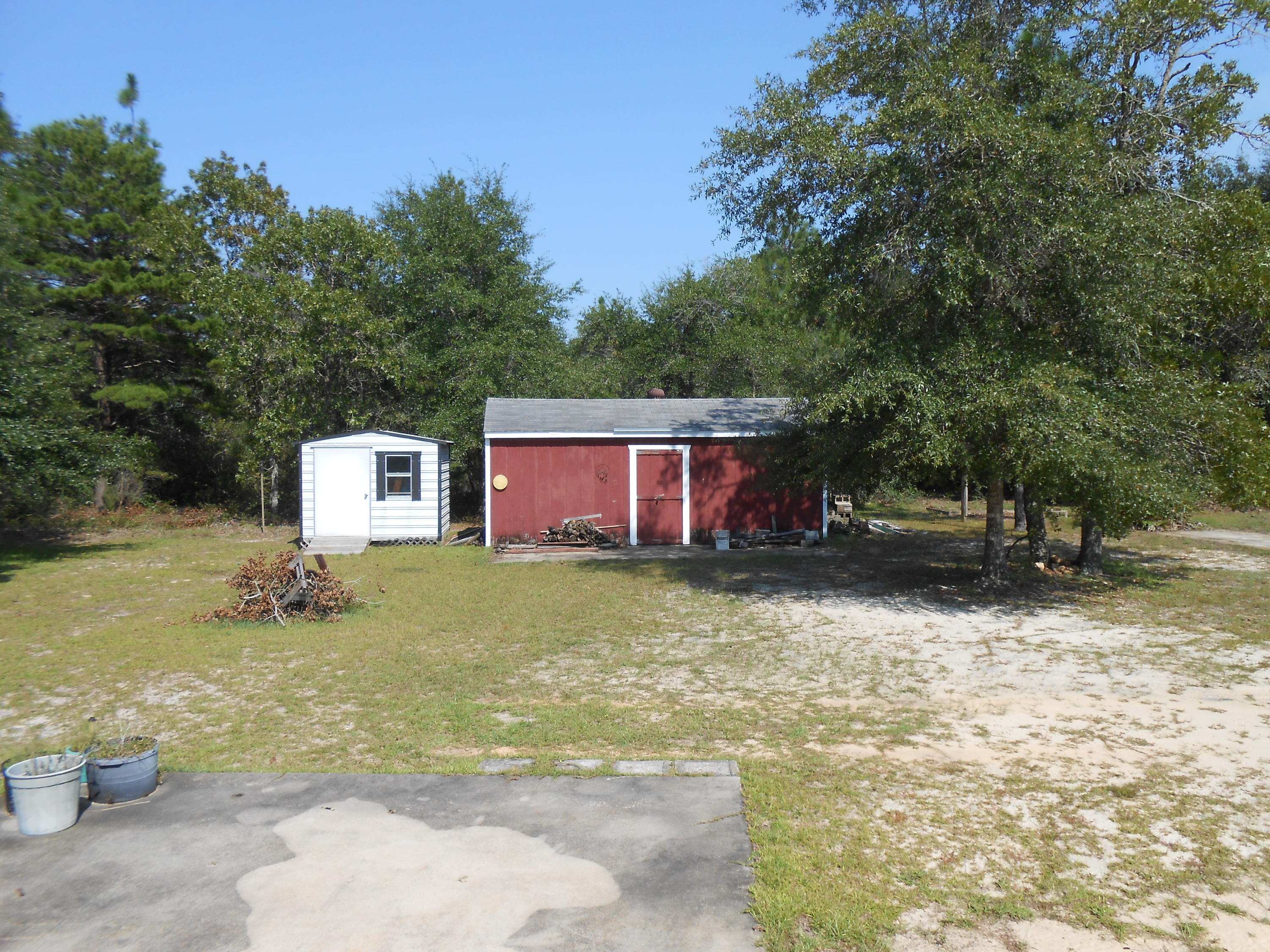 93 West Raphael Road DeFuniak Springs, FL 32433 - Photo 2 of 27 a view of a house with a yard