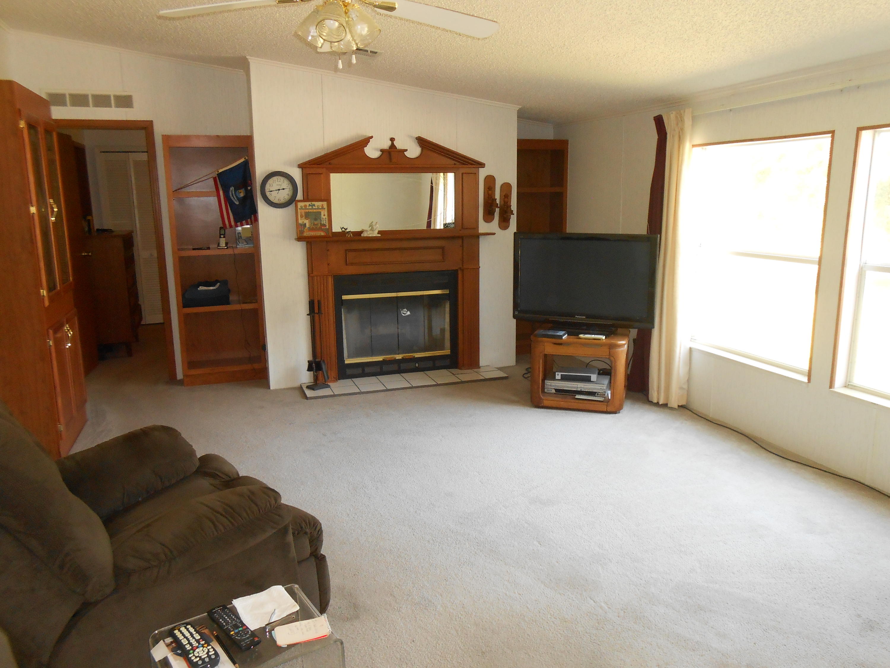 93 West Raphael Road DeFuniak Springs, FL 32433 - Photo 22 of 27 a living room with furniture and a fireplace