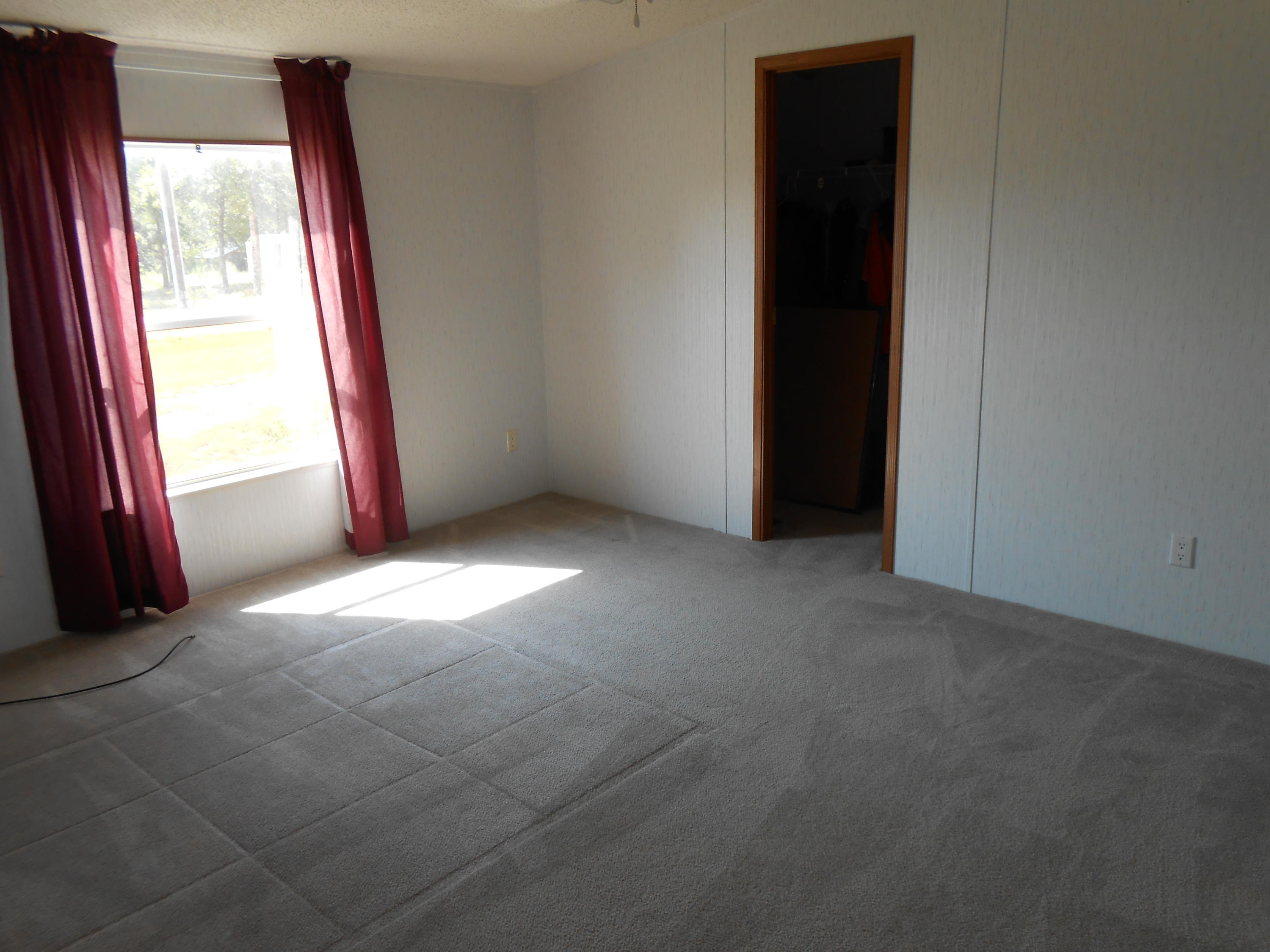 93 West Raphael Road DeFuniak Springs, FL 32433 - Photo 26 of 27 an empty room with windows and closet