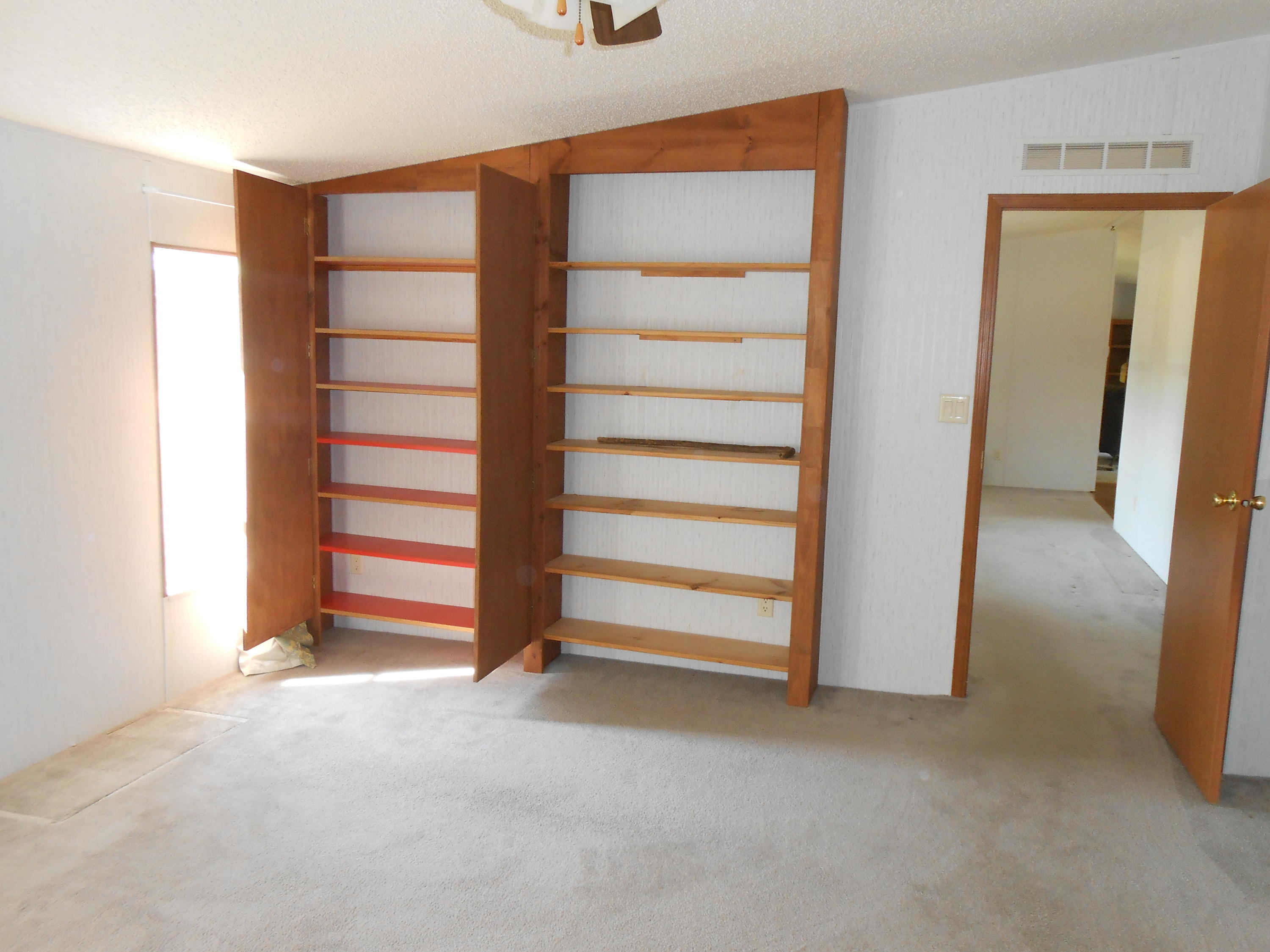 93 West Raphael Road DeFuniak Springs, FL 32433 - Photo 8 of 27 a view of room with walk in closet and window