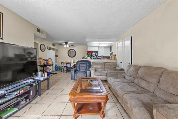 a kitchen with a refrigerator and sink