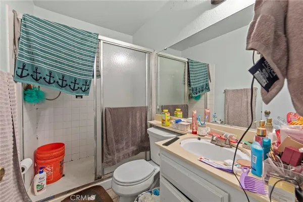 a view of walk in closet with clothes