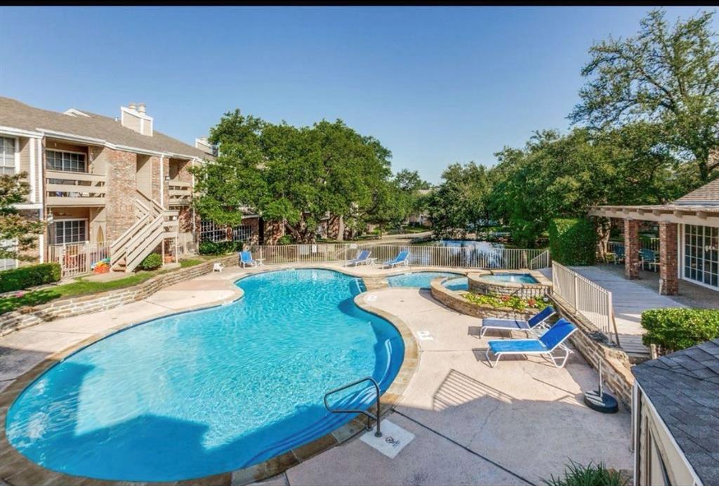 3550 Country Square Drive, Unit 109 Carrollton, TX 75006 - Photo 2 of 13 Community pool with a patio area and a hot tub