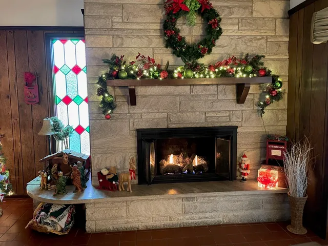 a living room with a fireplace furniture and a fireplace