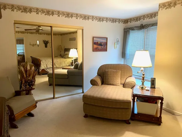 a bedroom with a bed and lamp