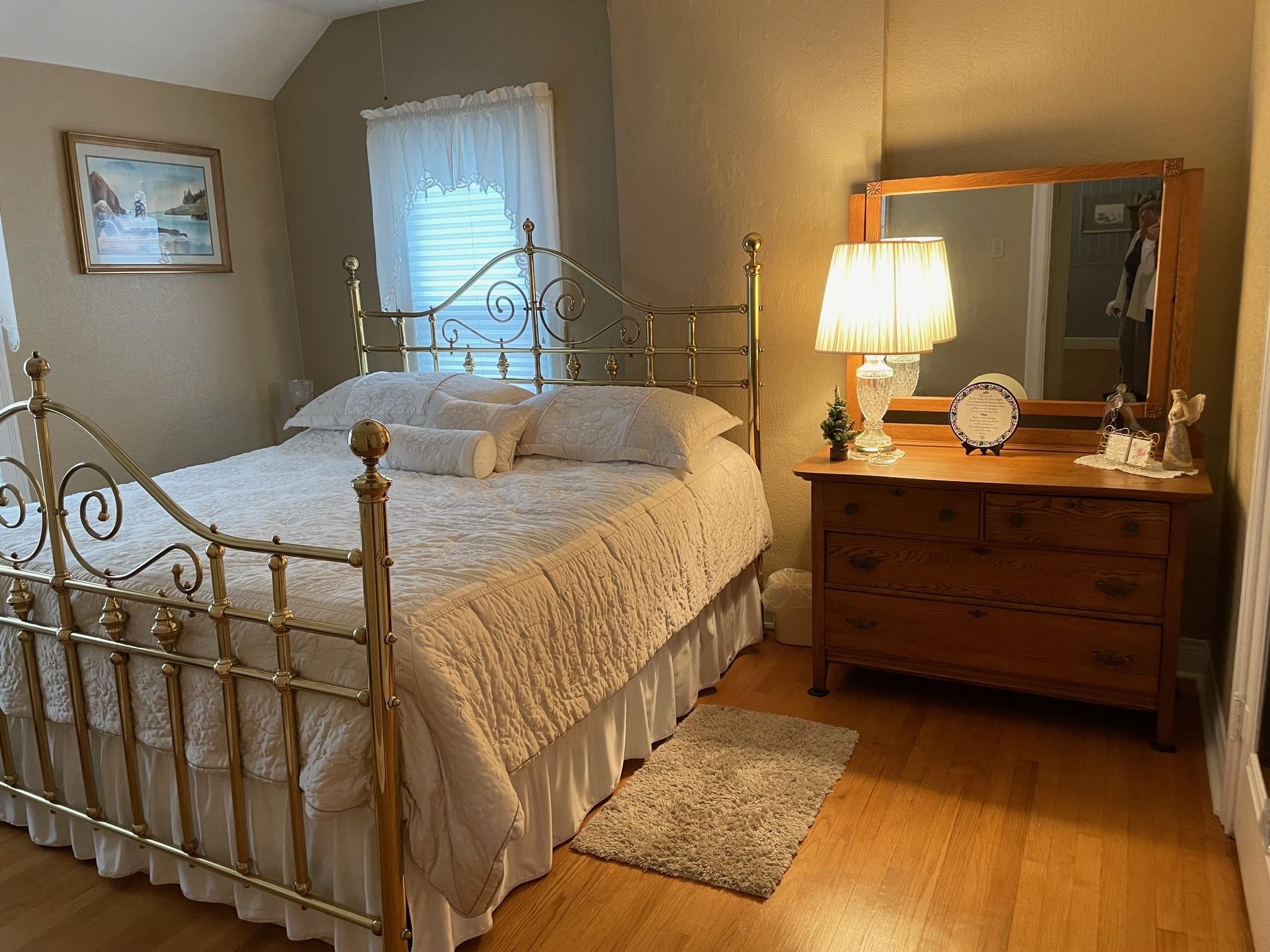 2004 Wall Street Murphysboro, IL 62966 - Photo 26 of 30 a bedroom with a bed a mirror on the dresser and a chandelier