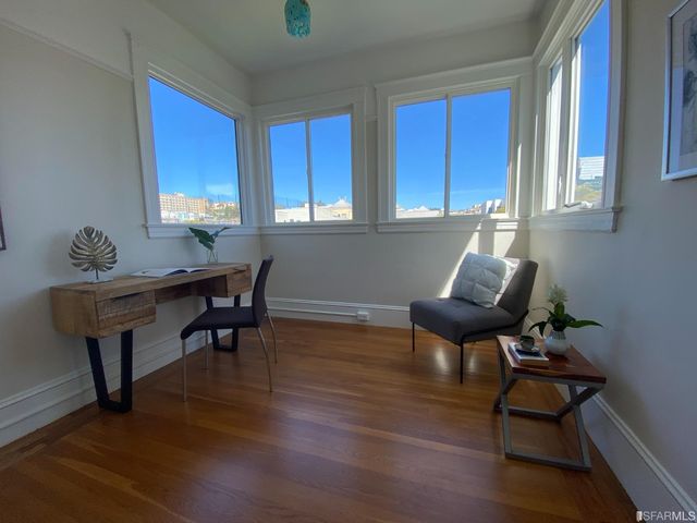 a kitchen with a stove a refrigerator and a more cabinets