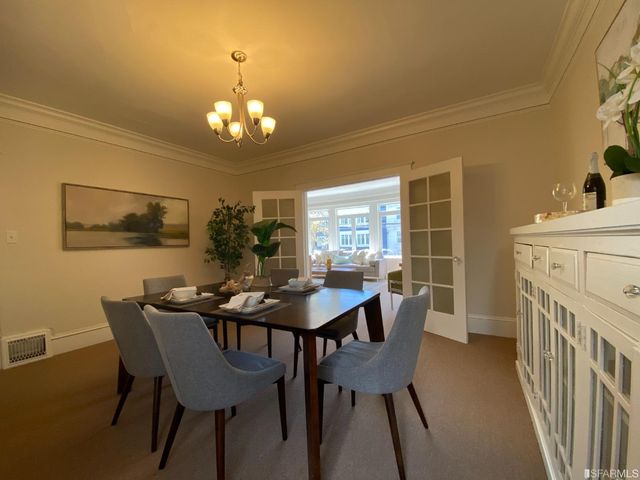 a view of a chairs and table on the deck with wooden floor