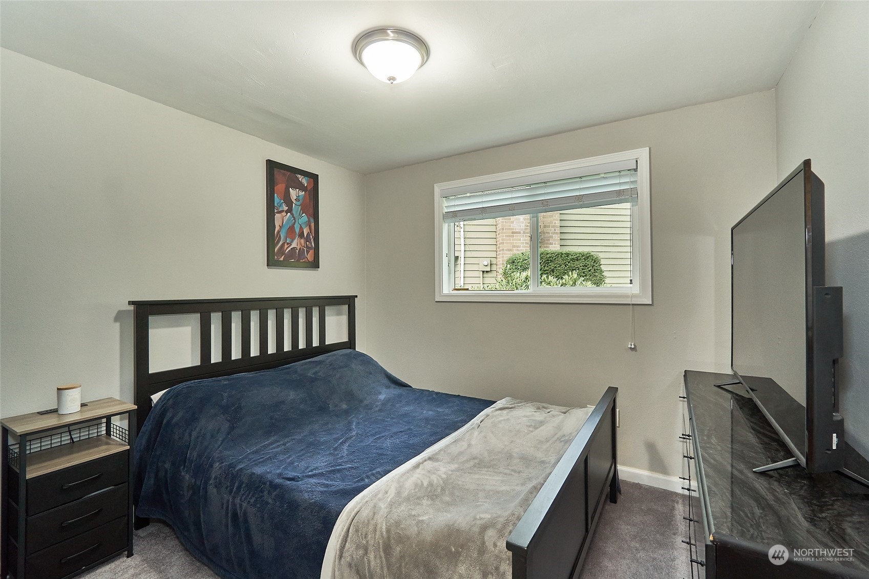 108 183rd Street Southwest Bothell, WA 98012 - Photo 15 of 22 a bedroom with a bed and a flat screen tv