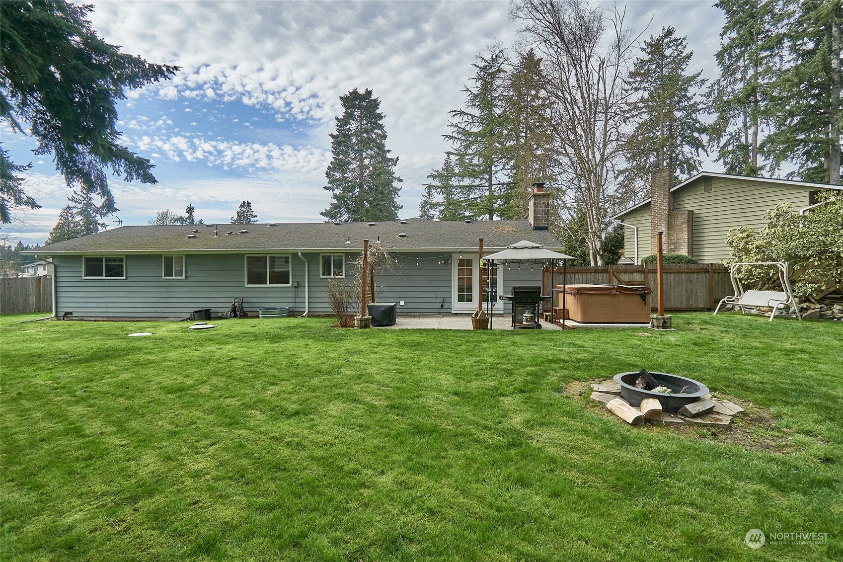 108 183rd Street Southwest Bothell, WA 98012 - Photo 21 of 22 a backyard of a house with table and chairs