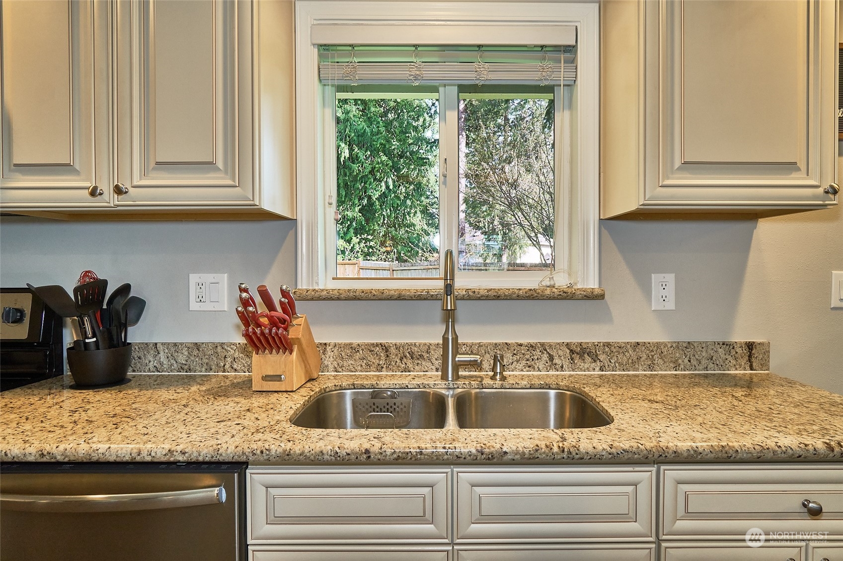 108 183rd Street Southwest Bothell, WA 98012 - Photo 8 of 22 a kitchen with granite countertop cabinets and window