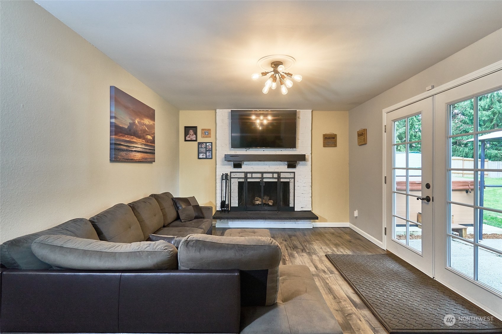 108 183rd Street Southwest Bothell, WA 98012 - Photo 10 of 22 a living room with furniture a fireplace and a flat screen tv
