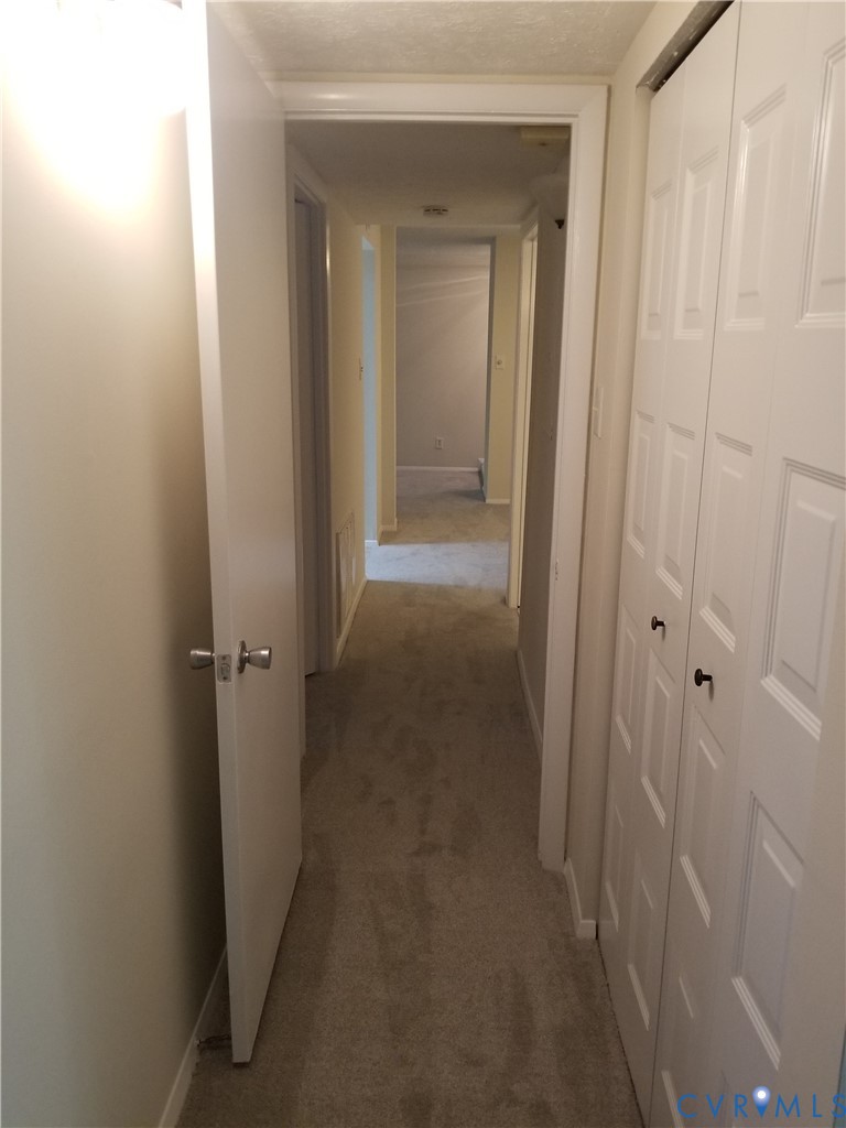 1505 Largo Road, Unit T2 Henrico, VA 23238 - Photo 3 of 7 a view of a hallway with a wooden door