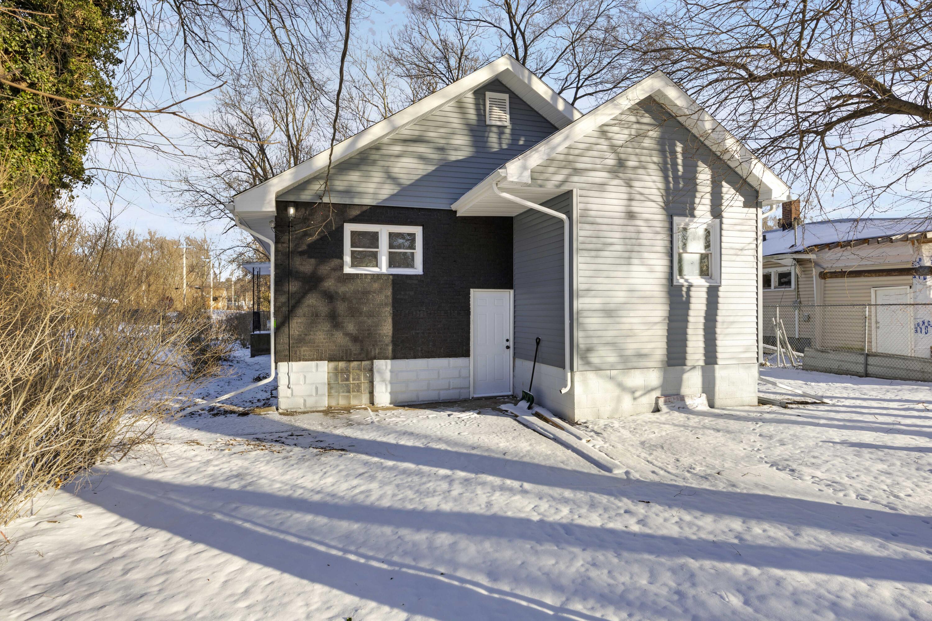 4200 Monroe Street Gary, IN 46408 - Photo 23 of 25 a view of a house with a yard covered with snow