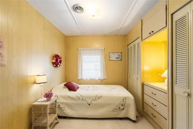 a bedroom with a bed and window