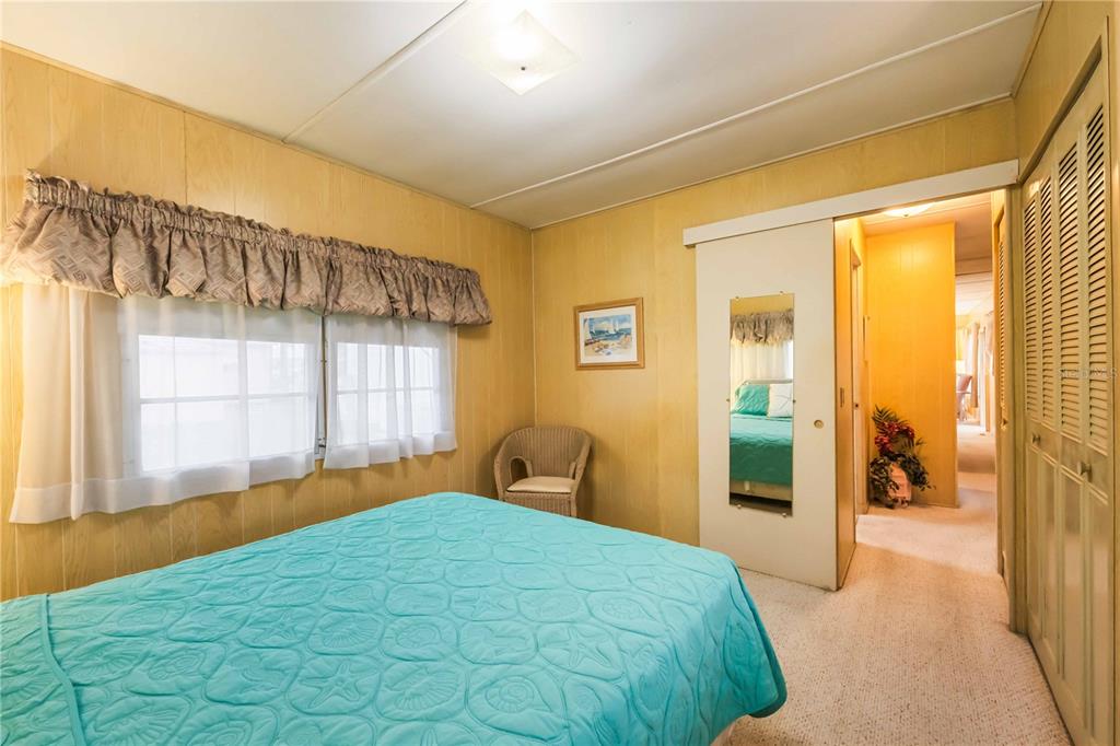 239 Inner Drive East Venice, FL 34285 - Photo 20 of 48 a bedroom with a large bed and a large window