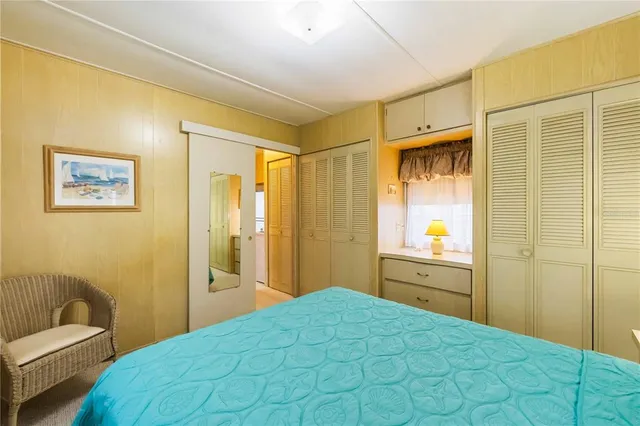 a bedroom with a bed and a couch