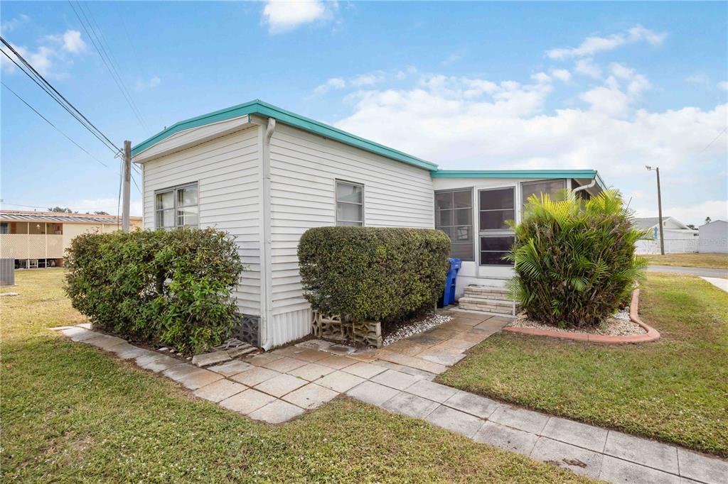 239 Inner Drive East Venice, FL 34285 - Photo 34 of 48 a view of a backyard with plants and a garden