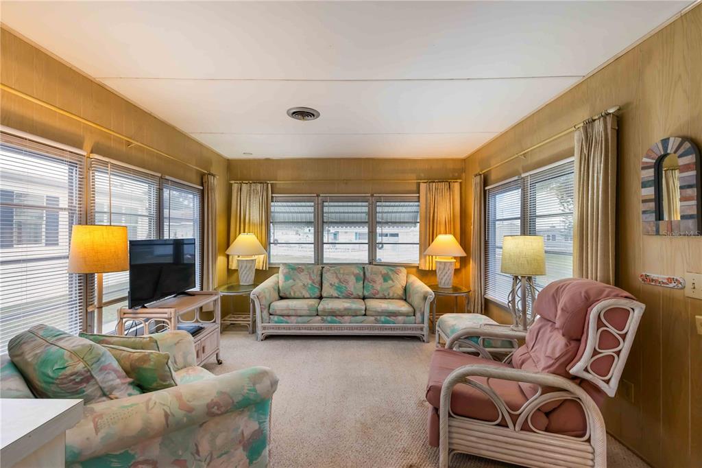 239 Inner Drive East Venice, FL 34285 - Photo 7 of 48 a living room with furniture and a large window