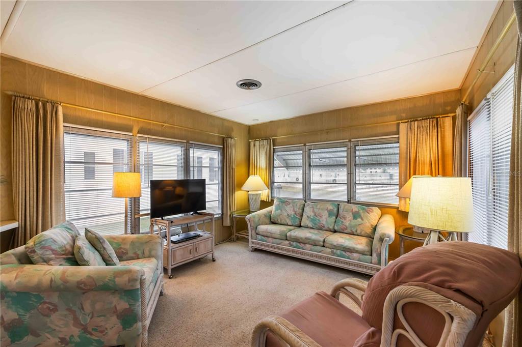 239 Inner Drive East Venice, FL 34285 - Photo 8 of 48 a living room with furniture and a flat screen tv