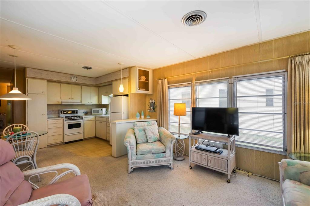 239 Inner Drive East Venice, FL 34285 - Photo 9 of 48 a living room with furniture and flat screen tv