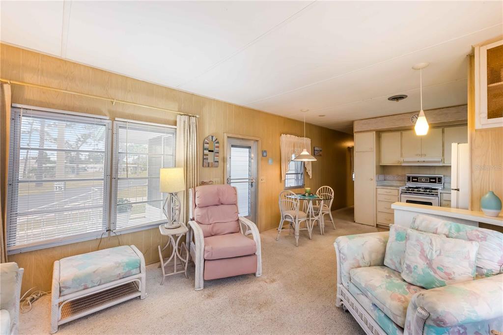 239 Inner Drive East Venice, FL 34285 - Photo 10 of 48 a living room with furniture and a large window