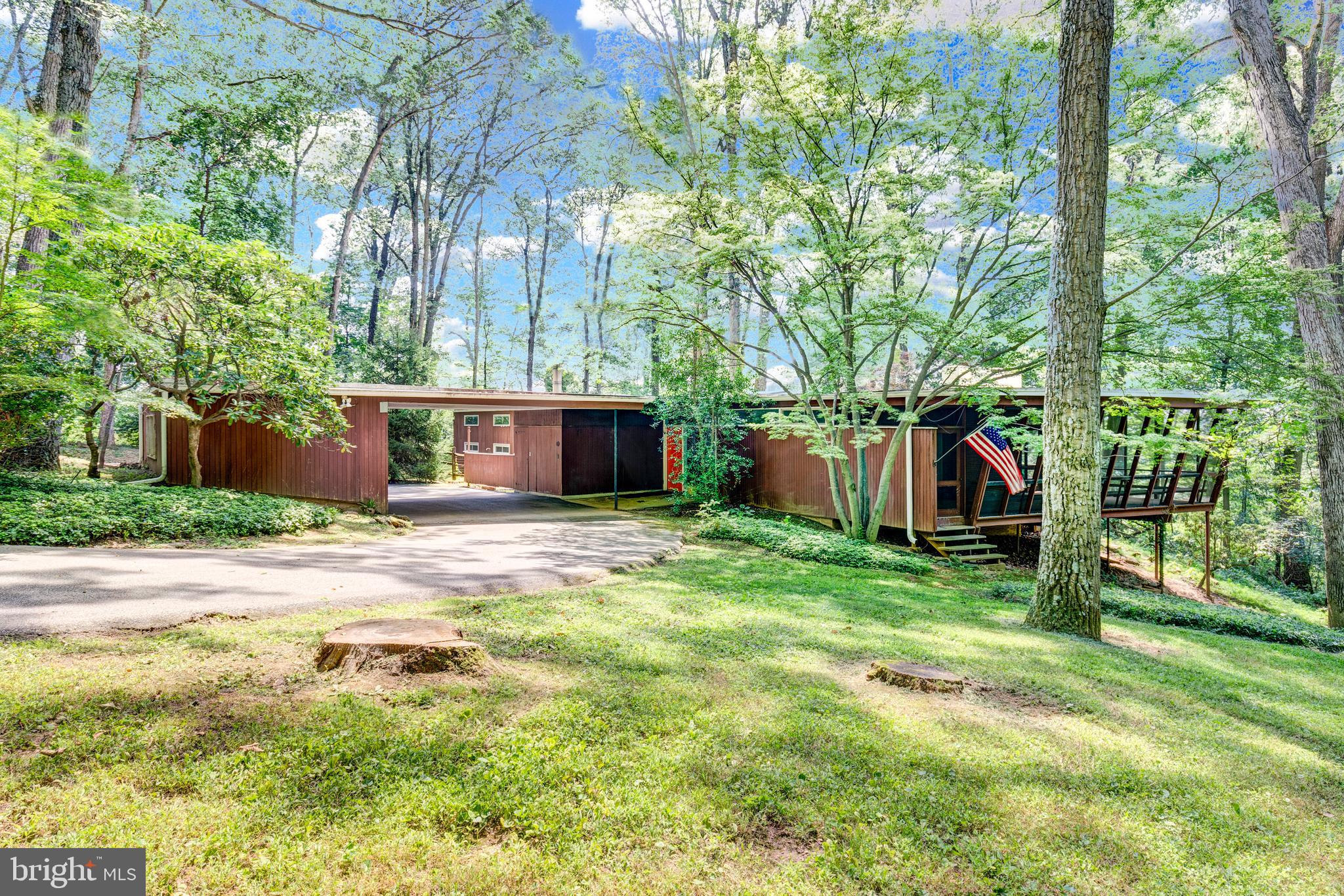 a view of an house with backyard space and garden