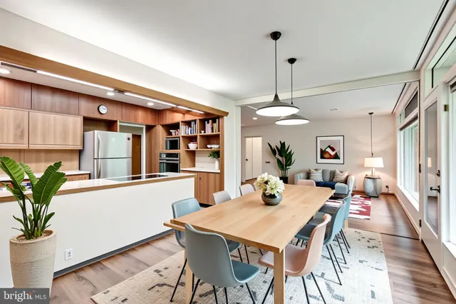 a kitchen with stainless steel appliances granite countertop a stove and a refrigerator