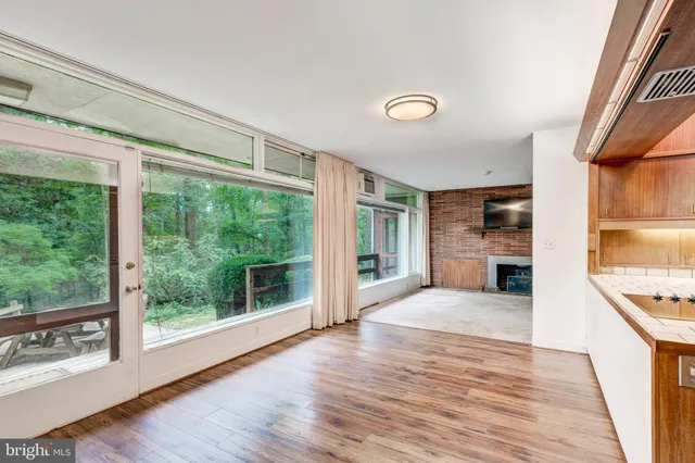 a kitchen with a refrigerator and a stove