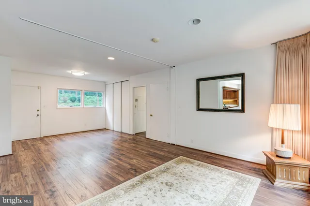 a bedroom with furniture and windows