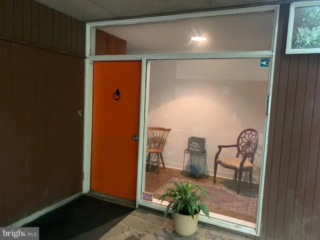 a view of a porch with wooden floor and outdoor space