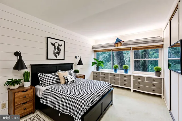 a bedroom with a bed and a couch