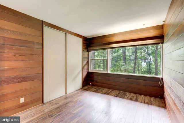 a bathroom with a sink vanity mirror and toilet
