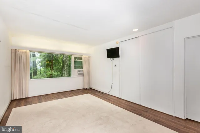 a bathroom with a shower and a sink